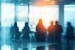 © Nico - Group of Professionals Engaged in Discussion Behind Glass Walls in Modern Office Environment