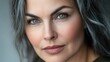 © O - Mature caucasian woman with gray hair and green eyes