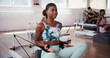 © peopleimages.com - Fitness, pilates and reformer with happy woman in class for improvement, training or workout routine. Equipment, exercise and smile with person on machine in studio for challenge or performance