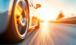 © NovaVision - A sports car races at high speed with motion blur on a road at sunset.