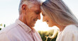 © peopleimages.com - Senior couple, care and forehead touch for love, strong connection and healthy relationship. Romance, happy man and woman outdoor for bonding together, loyalty or commitment to marriage in retirement