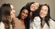 © peopleimages.com - Laugh, friends and portrait of women in studio for skincare, cosmetics and makeup. Beauty, brown background and face of people with natural skin for inclusion, diversity and glow for facial treatment