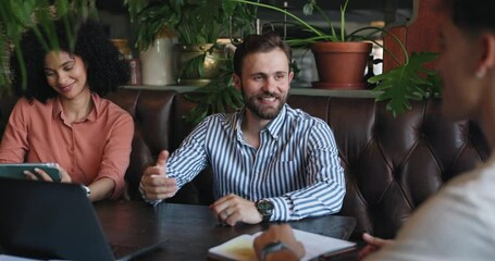 Poster - Business, handshake and people with tablet, cafe and smile for meeting, collaboration or greeting. Team, group and shaking hands for agreement in coffee shop, gesture or publicist with tech for deal