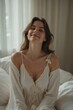 © kineter_ai - Serene Morning Awakening: Young Woman Sitting on Bed with a Peaceful Smile, Enjoying the Calmness of the Early Hours and Preparing for a Positive Day