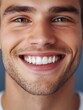 © Diclonius - a close-up portrait of a happy man smiling and showing his teeth