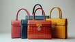 © qazi - Designer handbags with luxury materials and elegant detailing displayed on a white background