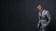 © Sajid - A middle-aged businessman in a wrinkled gray suit, side profile with head down, eyes closed, and a somber expression