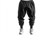 © aanz - Display of Black Jogger Pants with White Sneakers on White Background