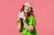 © kohanova1991 - Happy woman with alarm clock on pink background. Early morning, correct day routine, living in moment, appreciate every minute of life, youth.