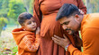 © Arnav Pratap Singh - Young pregnant woman with her husband and child, enjoying outdoor, indian family concept
