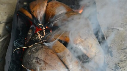 Traditional cooking with a stove made of clay and a hot pot boiling water