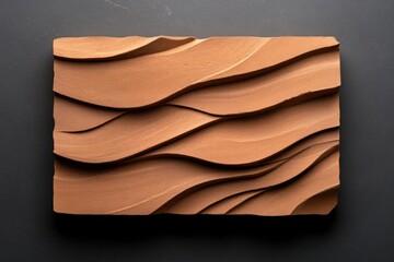 Aufkleber - Brown Textured Wavy Panel on Dark Background Showing Granular Surface and Relief