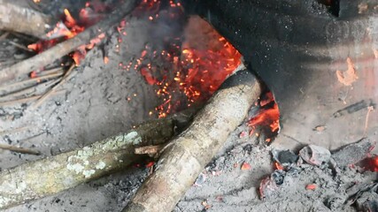 Traditional cooking with a stove made of clay and a hot pot boiling water