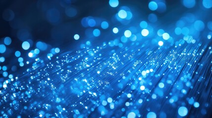 Poster - A stunning, abstract image of blue fiber optic strands illuminated with light, showcasing their intricate structure and vibrant glow.