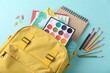 © hussain-01 - 'A bright and cheerful backpack with a variety of school supplies peeking out, including a watercolor set, sticky notes, and sharpened pencils, set against a fresh light blue background.'
