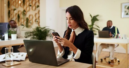 Poster - Business woman, interior designer or typing with phone on laptop for online communication or design at office. Female person, agent or decor stylist with mobile smartphone for product checklist