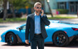 © Volodymyr - Rich businessman near luxury car. Rich businessman outdoor. Elegant rich businessman. Boss with luxury expensive car. Rich businessman standing on premium car. Business success. Riches concept.