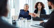 © peopleimages.com - Happy, business people and meeting with handshake for agreement, deal or partnership at office. Businessman, woman or colleagues shaking hands with team for introduction or greeting at workplace