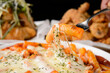 © Donghyun Kim - Lifting the rice cake of Cheese Tteokbokki with a fork to show the cheese stretching