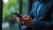 © WisChi - Businessman Using Smartphone Checking Emails Modern Office Close Up Hands
