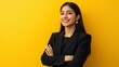 © RamvijayB - Confident Indian woman in formal black blazer posing against yellow background generative ai
