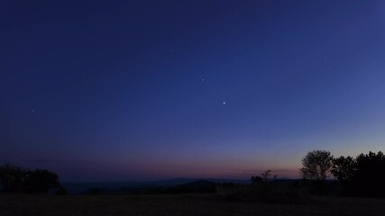 Wall Mural - countryside silhouettes under the stars, meteor trail and crescent moon.