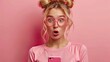© Svfotoroom - A cheerful woman with blonde hair and a pink outfit displays surprise and happiness while looking at her phone against a magenta backdrop