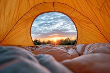 Wall Mural - Golden sunrise view from inside cozy tent in peaceful outdoor campsite