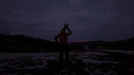 Wall Mural - amateur astronomer looking at the cloudy evening skies, expecting for observing planets, stars, moon