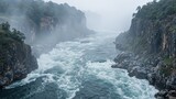Majestic river canyon with fast water steep rocky walls and swirling mists showcasing raw untamed power