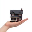© Ida - Miniature house held in hand