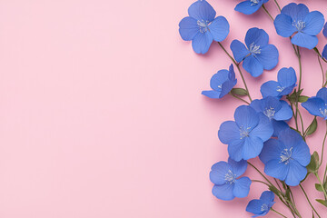 Poster - A romantic scene with scattered blue petals from small flowers, set against a pale pink background
