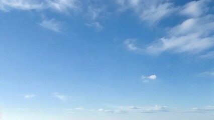 Wall Mural - light blue vault of heaven, filmy clouds wandering. the light blue sky is pure and vast. a few filmy