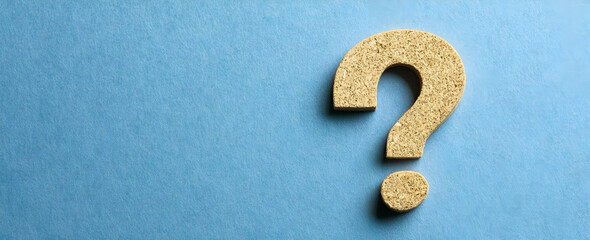 Wall Mural - photo of a question mark on a blue background, symbolizing curiosity and questions