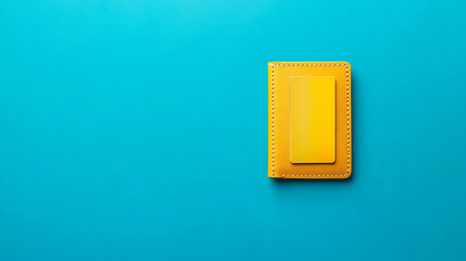 Poster - Top view of a credit card in a yellow wallet on a blue background