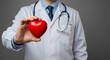 © adam - Doctor Holding Heart Symbol in Hands for Health and Love Concept