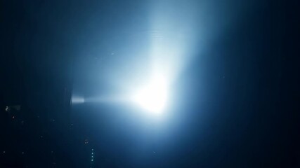 Wall Mural - mysterious light beam: captivating abstract shot of a brilliant light beam piercing through darkness