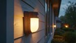 © Pete - Exterior motion sensor light illuminates home at dusk. Outdoor lighting residential area, creates serene atmosphere. Security and safety, automated modern illumination, smart tech lighting in evening.