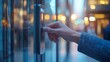© mafaza - Hand using digital access control system on glass door