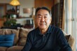 © NikoG - Portrait of a middle aged Asian man in a modern home