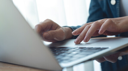 Wall Mural - close up of business woman hands typing on laptop computer, searching and surfing the internet with 