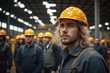 © He - man in a hard hat standing in front of a group of workers
