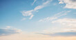© al-sultan - Breathtaking view of a pale blue sky with wispy white clouds at sunset. Background photos for banners, posters and wallpapers.