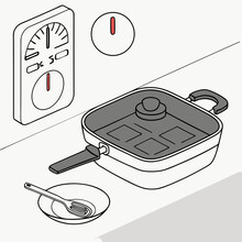 Electric skillet with timer and plate on a kitchen countertop  