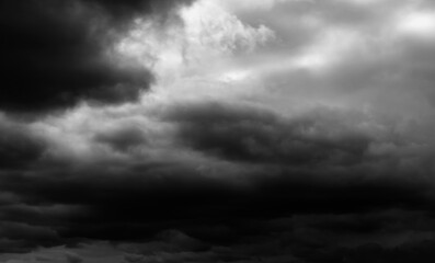 Wall Mural - dark dramatic sky with black stormy clouds before rain as abstract background, extreme weather