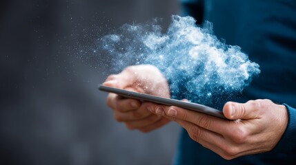Fototapete - A person holds a tablet from which a holographic cloud storage icon emerges, glowing with blue light, representing advanced technology and data connectivity