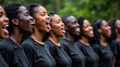© Atmospheres - Side Profile of a Diverse African American Choir Singing Outdoors with Joyful Expressions in Black Shirts