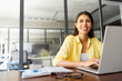 © Stock 4 You - Young woman employee using pc for business work. Smiling latin female studying student, coder programmer working at laptop computer sitting at desk in modern office, dreaming looking at copy space