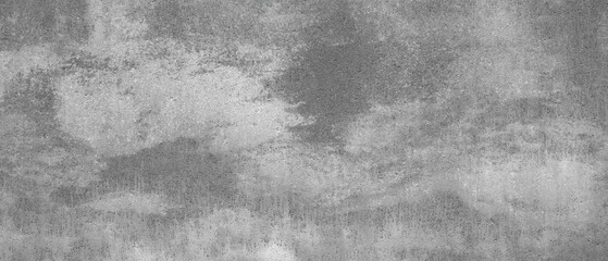 Aufkleber - A grey wall with a cloudy sky in the background. The wall is made of concrete and has a rough texture