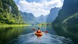 © JoaoNalio - Kayaker explores serene waters surrounded by majestic mountains, enjoying a peaceful escape into nature's embrace, in the midst of the lake.
